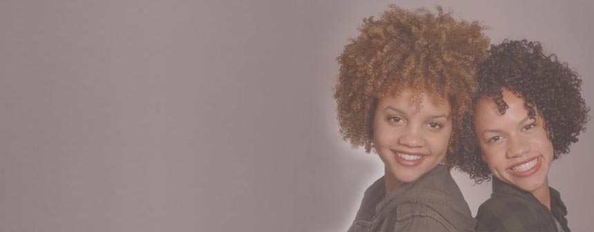 Cute sisters with curly hair styled by Anya